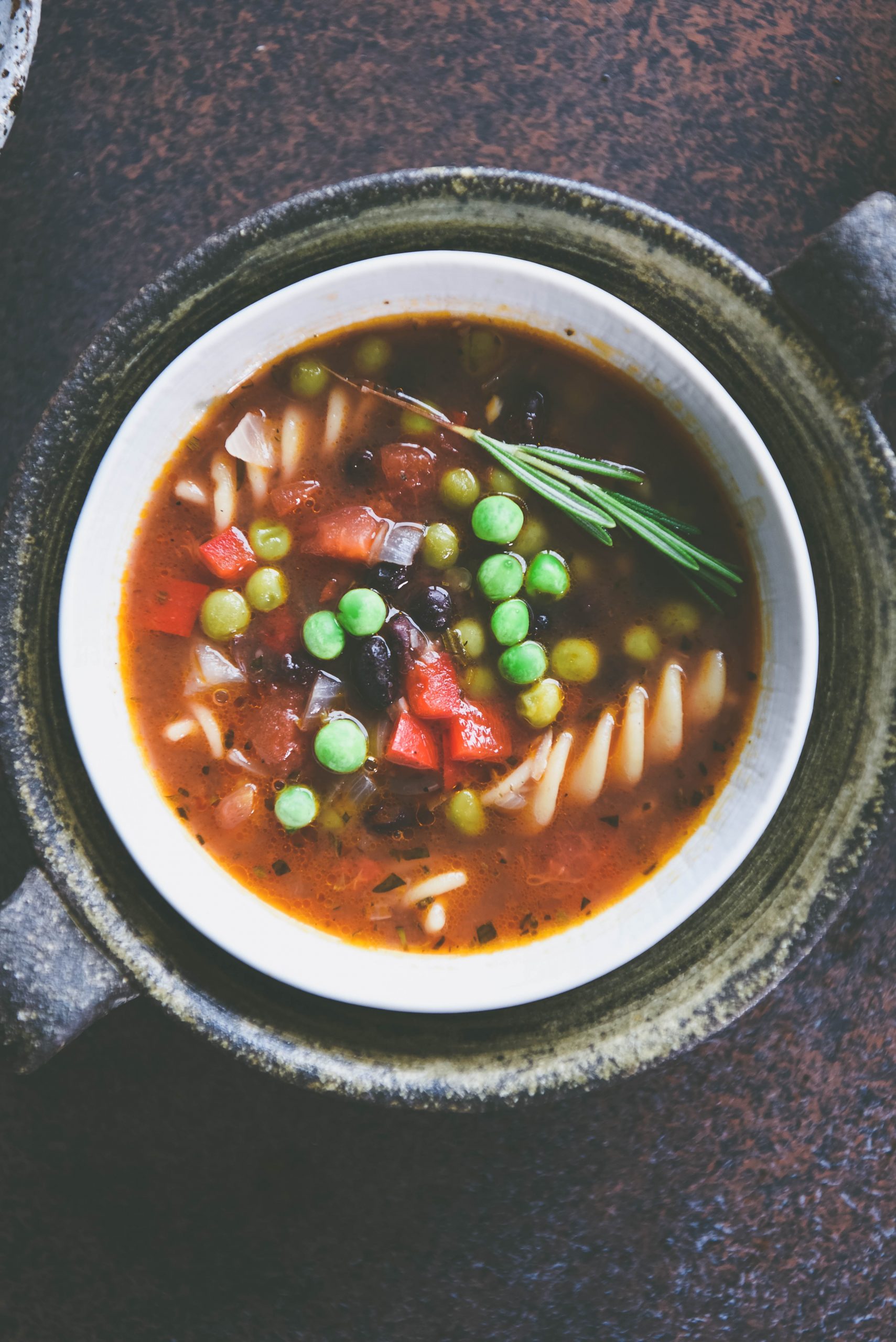 A close up top view of Black Bean and Pasta Soup in two bowls